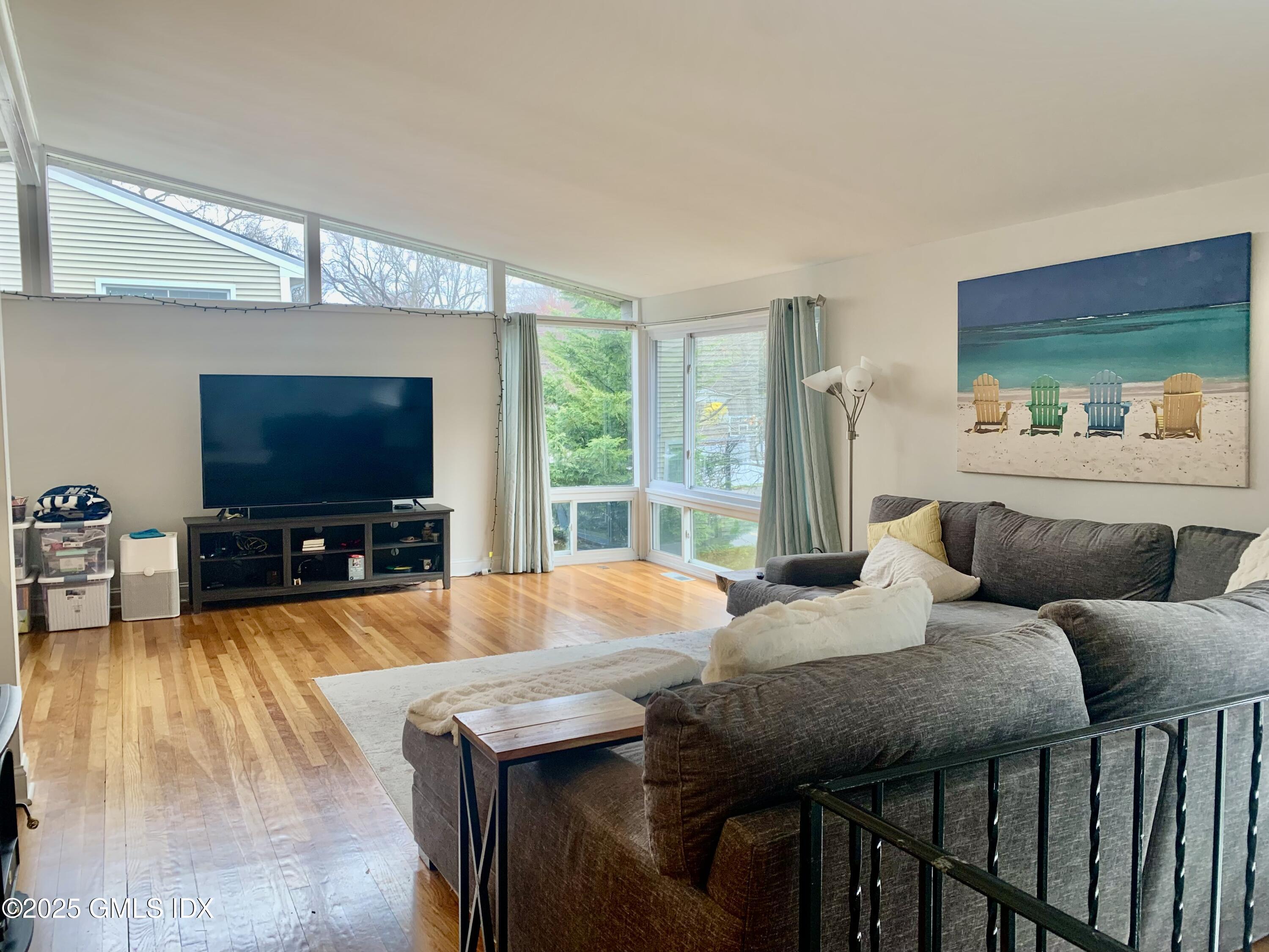 67 Florence Road Riverside, CT 06878 - Photo 6 of 23 a living room with furniture and a flat screen tv