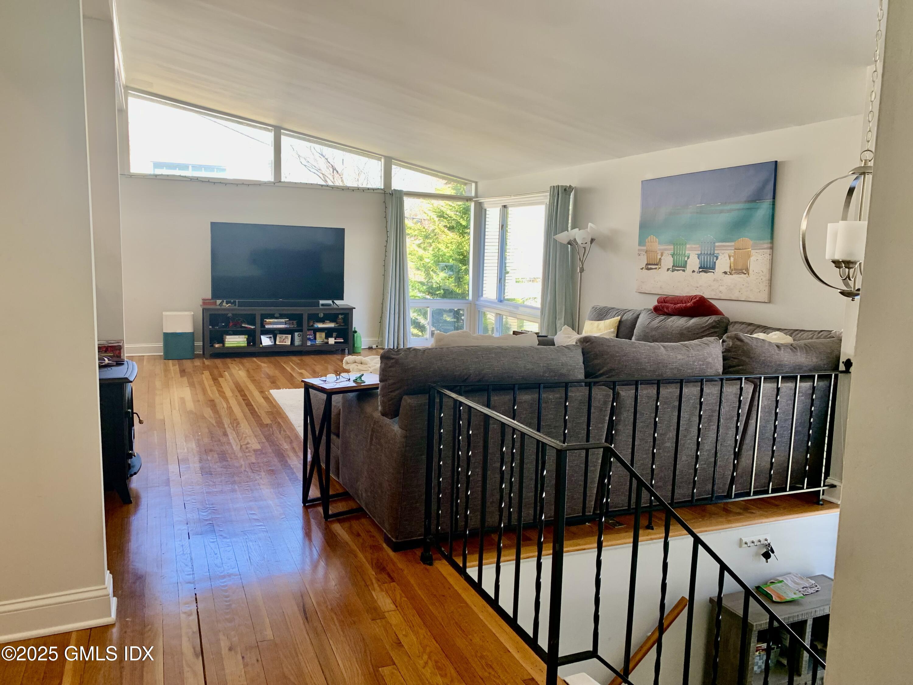 67 Florence Road Riverside, CT 06878 - Photo 8 of 23 a living room with furniture and a flat screen tv