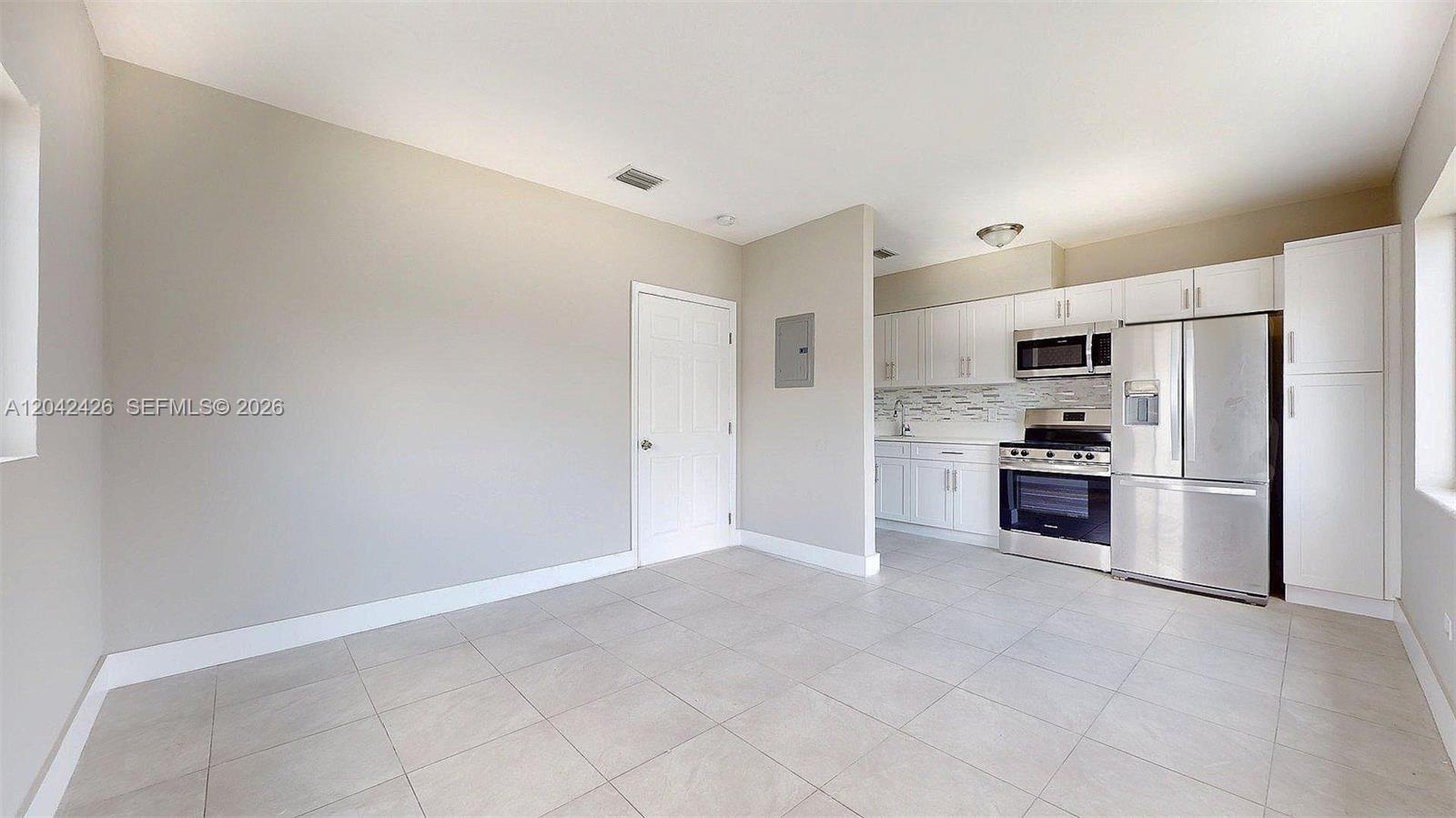 74 West 15th Street, Unit 1 Hialeah, FL 33010 - Photo 6 of 23 Living & Kitchen