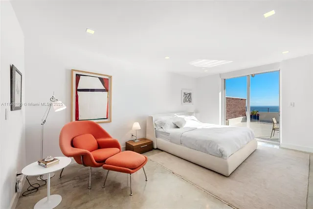 a spacious bathroom with a double vanity sink toilet mirror and bathtub