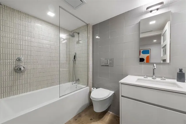 a kitchen with a sink and a refrigerator