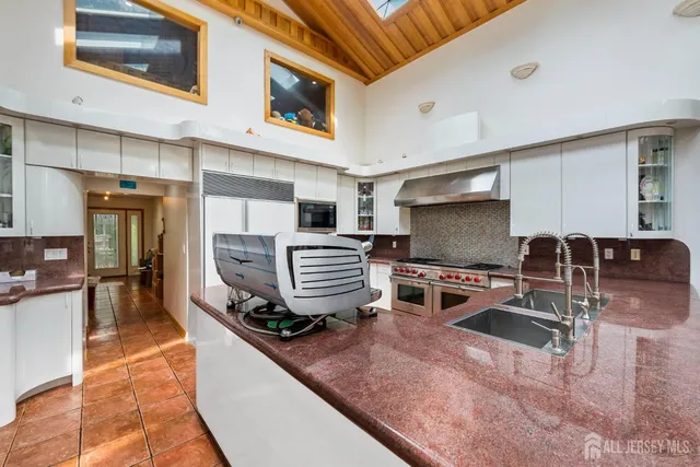 a bedroom with a bed furniture and a book shelf