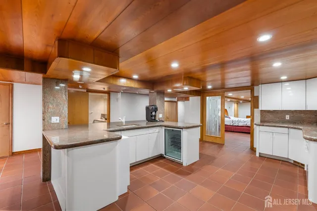 a large white tub sitting in a bathroom