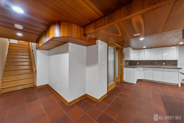 a view of a patio with table and chairs and potted plants