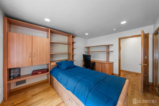 a living room with furniture and a piano