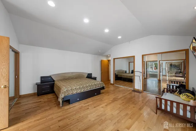 an aerial view of residential houses with outdoor space and swimming pool