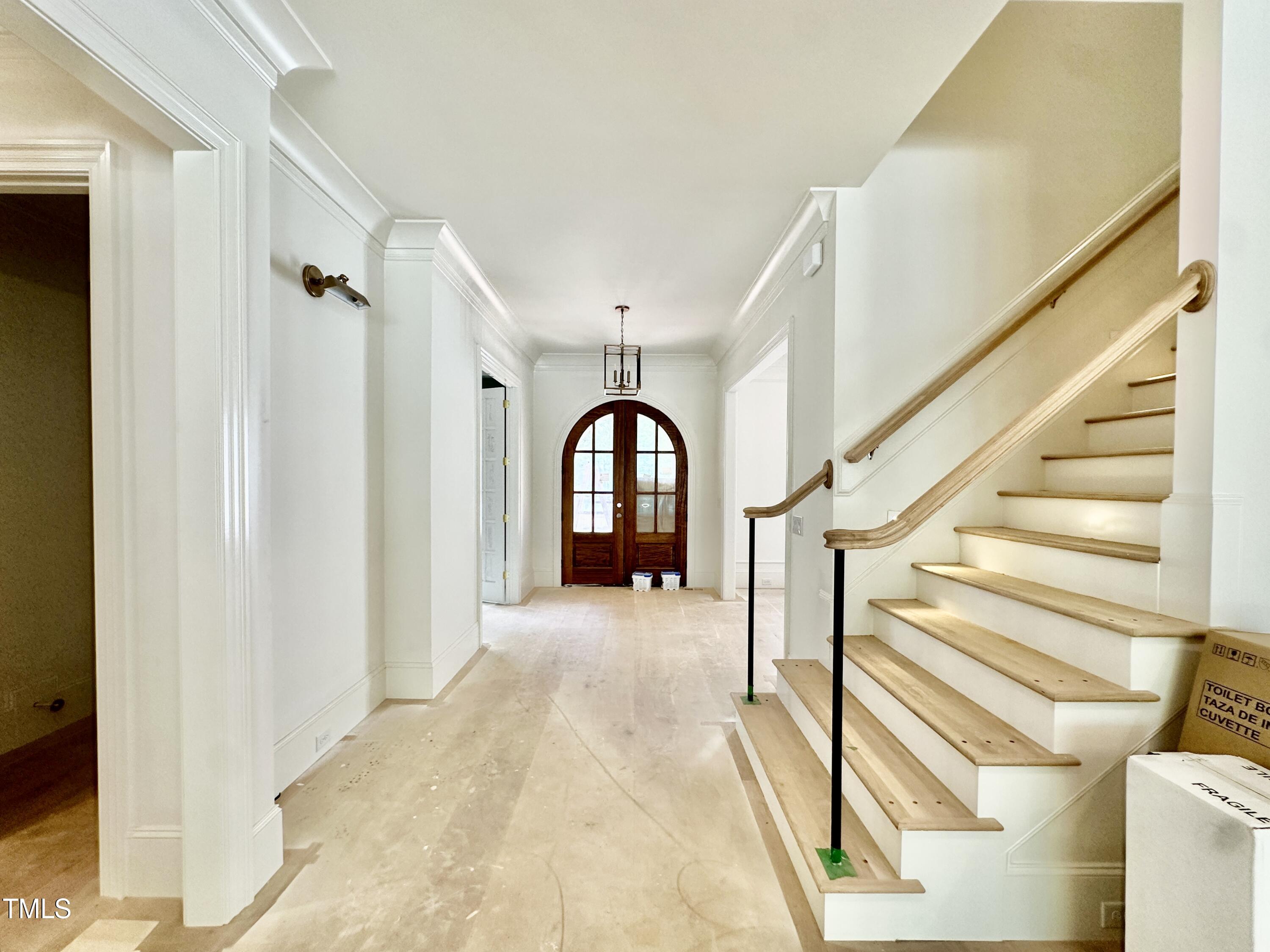 1409 Pony Run Road Raleigh, NC 27615 - Photo 12 of 53 a view of entryway and hall with wooden floor