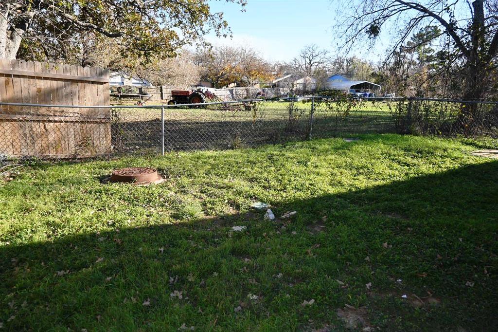 817 Lexington Road Elgin, TX 78621 - Photo 13 of 20 a view of a yard with a fountain
