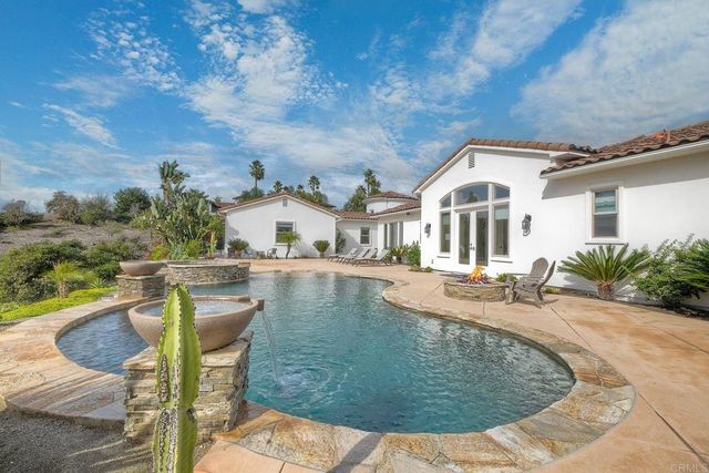 a view of a town with mountains in the background