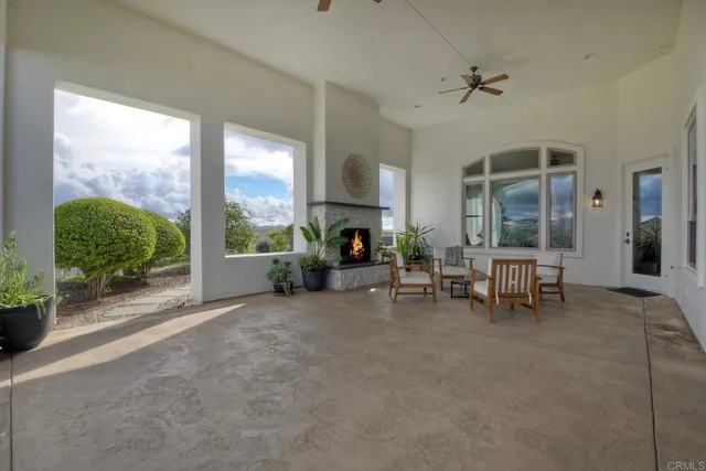 an aerial view of residential house with outdoor space and parking