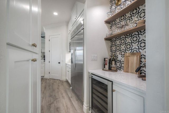 a kitchen with counter top space cabinets and stainless steel appliances