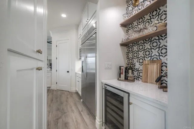 a kitchen with counter top space cabinets and stainless steel appliances