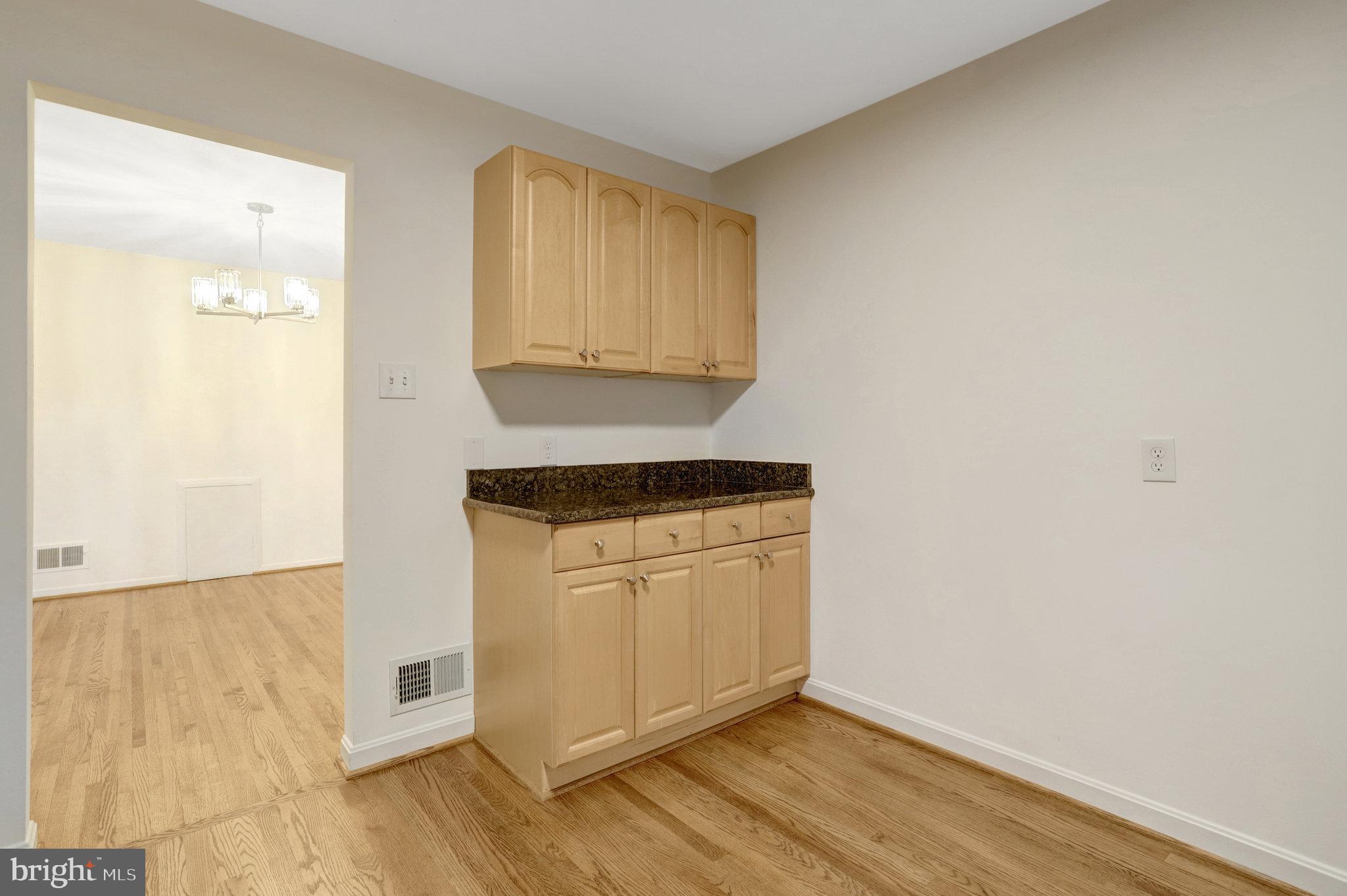 8626 Kerry Lane Springfield, VA 22152 - Photo 25 of 48 a room with wooden floor and white doors