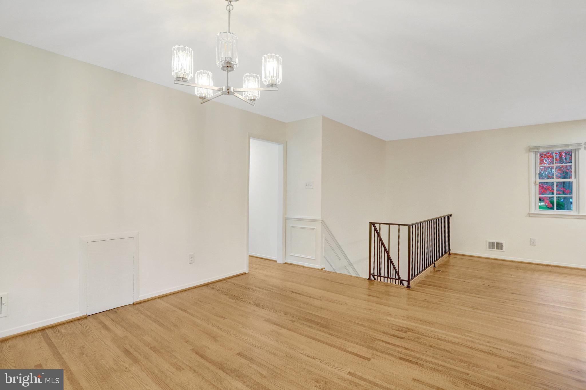 8626 Kerry Lane Springfield, VA 22152 - Photo 27 of 48 a view of empty room with wooden floor and window