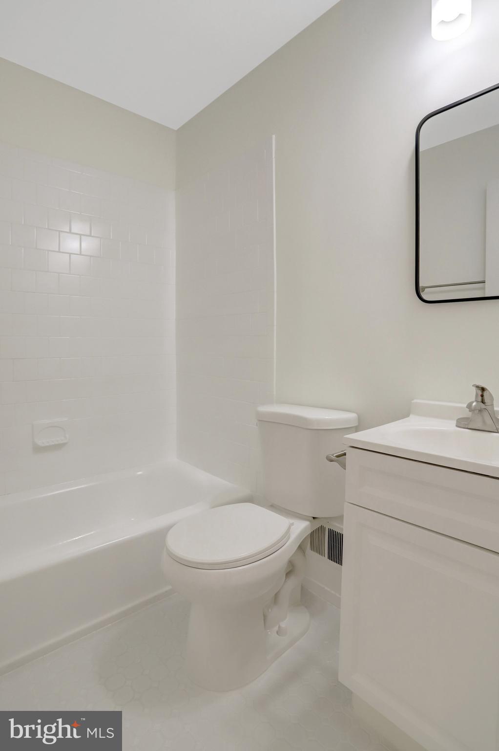 8626 Kerry Lane Springfield, VA 22152 - Photo 29 of 48 a white toilet sitting next to a bath tub