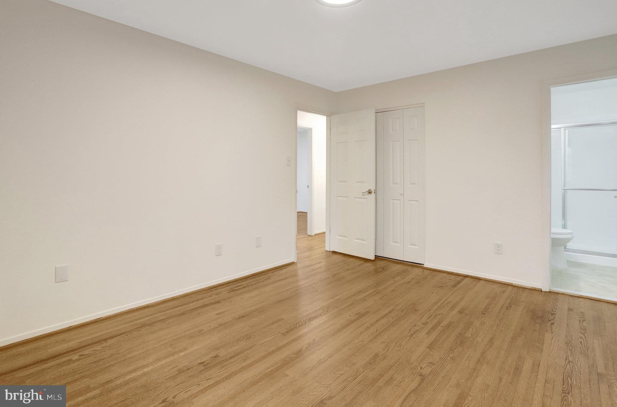 8626 Kerry Lane Springfield, VA 22152 - Photo 32 of 48 a view of an empty room with wooden floor
