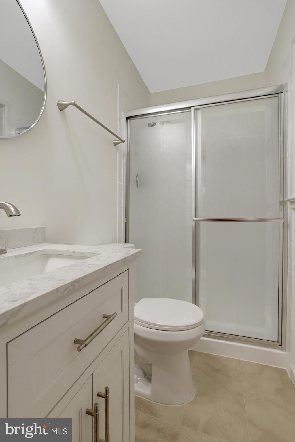 8626 Kerry Lane Springfield, VA 22152 - Photo 33 of 48 a bathroom with a shower a toilet and a sink