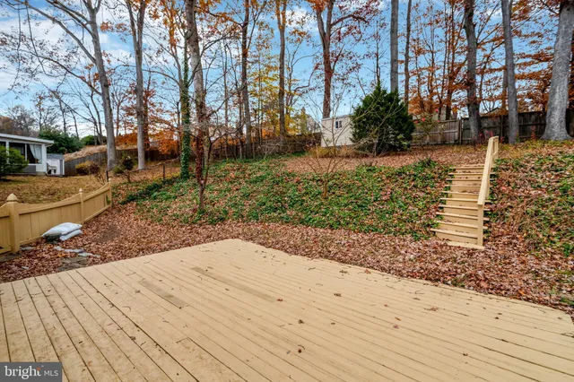 a view of a yard with snow on the road