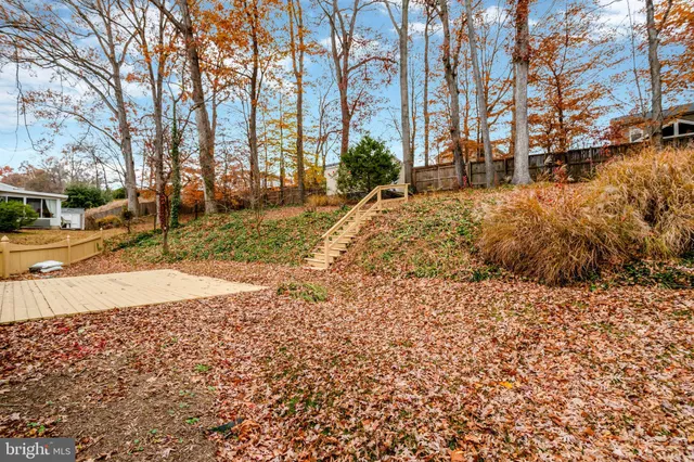 a backyard of a house with yard and outdoor seating