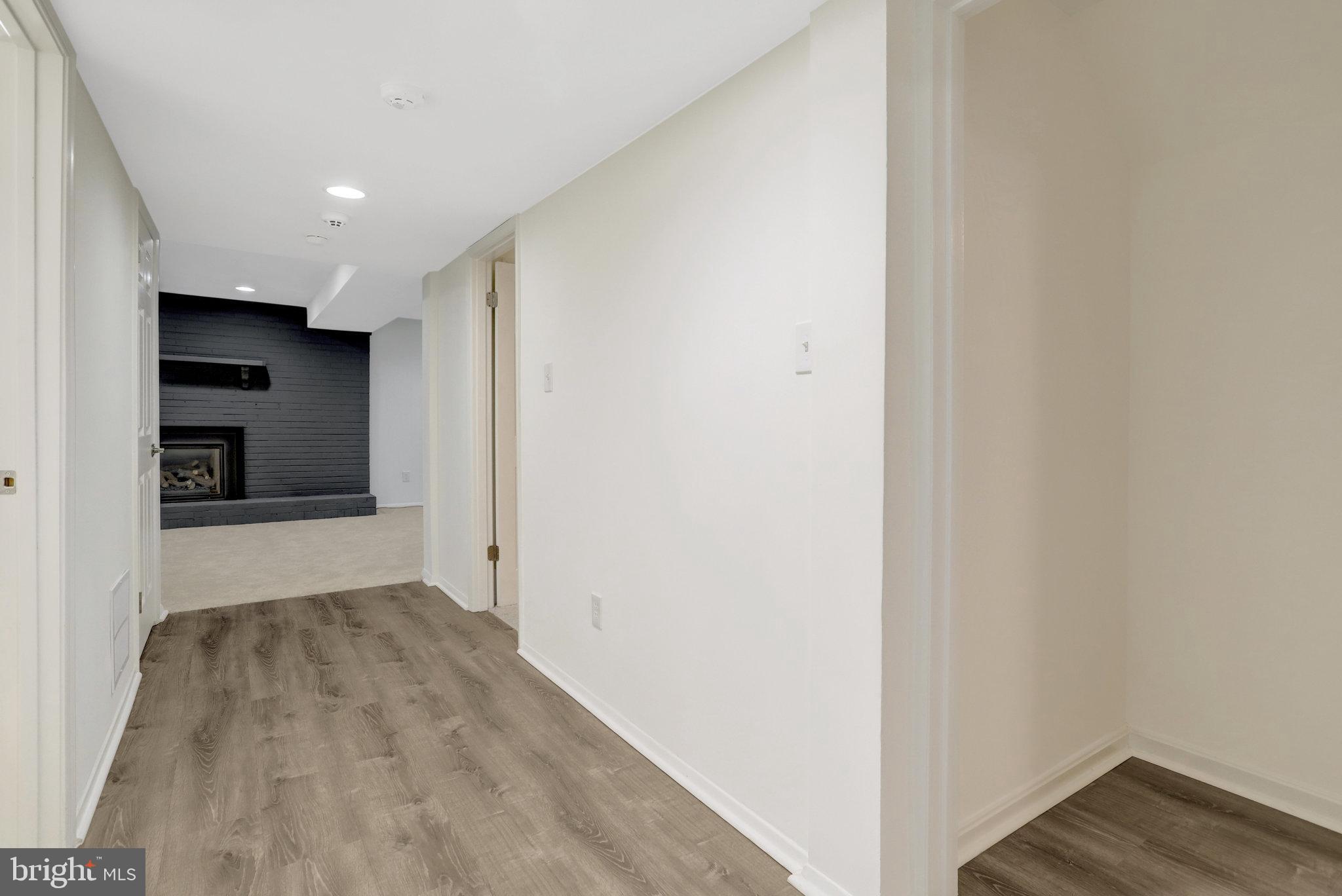 8626 Kerry Lane Springfield, VA 22152 - Photo 5 of 48 a view of hallway with wooden floor