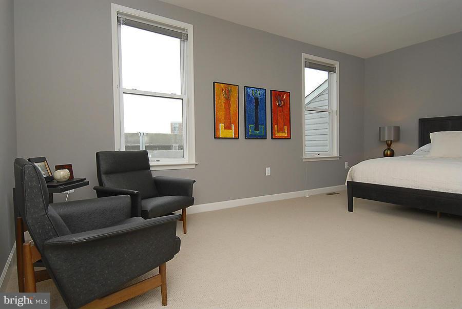 1360 Monroe Street Northwest, Unit B Washington, DC 20010 - Photo 11 of 19 a bedroom with furniture and a window