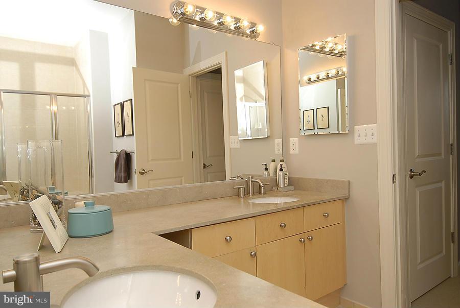 1360 Monroe Street Northwest, Unit B Washington, DC 20010 - Photo 12 of 19 a bathroom with a granite countertop sink mirror and double
