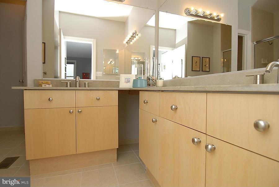 1360 Monroe Street Northwest, Unit B Washington, DC 20010 - Photo 13 of 19 a bathroom with a sink and a mirror
