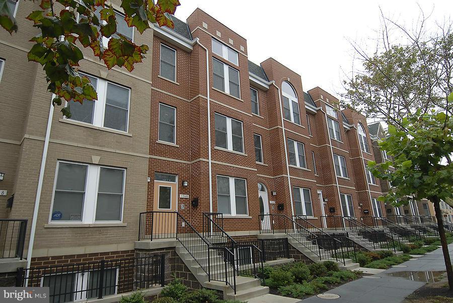 1360 Monroe Street Northwest, Unit B Washington, DC 20010 - Photo 19 of 19 a front view of a building with balcony