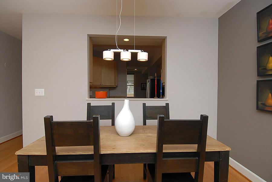 1360 Monroe Street Northwest, Unit B Washington, DC 20010 - Photo 3 of 19 a view of a dining room with furniture and wooden floor