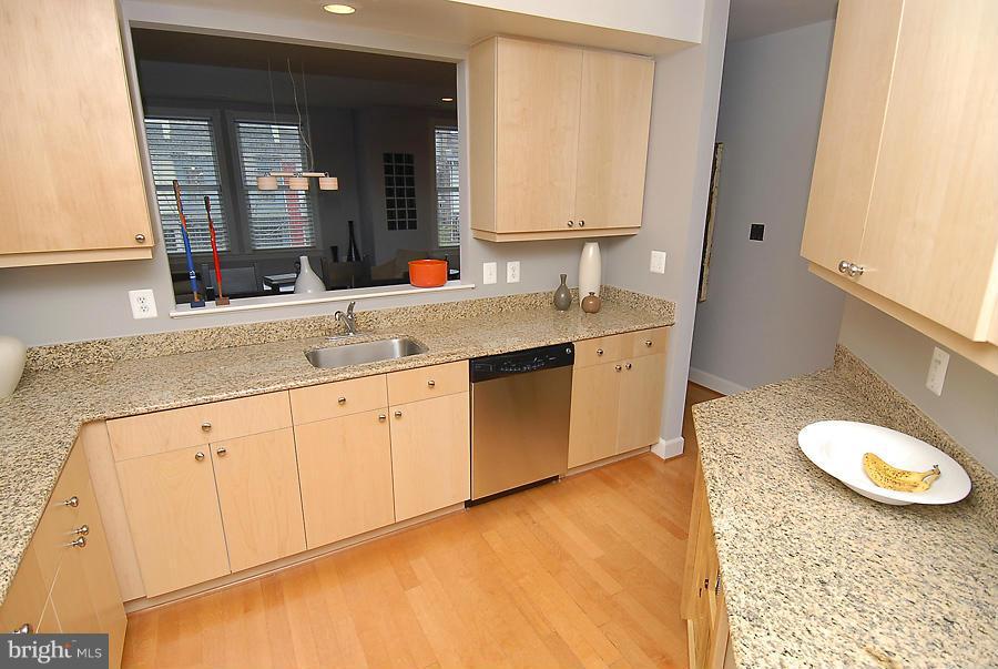 1360 Monroe Street Northwest, Unit B Washington, DC 20010 - Photo 4 of 19 a spacious bathroom with a granite countertop sink and a mirror