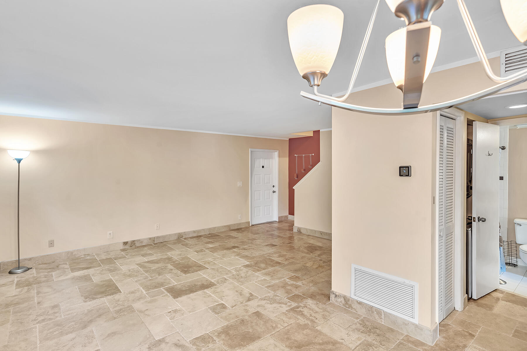 1945 Northwest 4th Avenue, Unit 32C Boca Raton, FL 33432 - Photo 13 of 52 a view of a livingroom with wooden floor and entryway