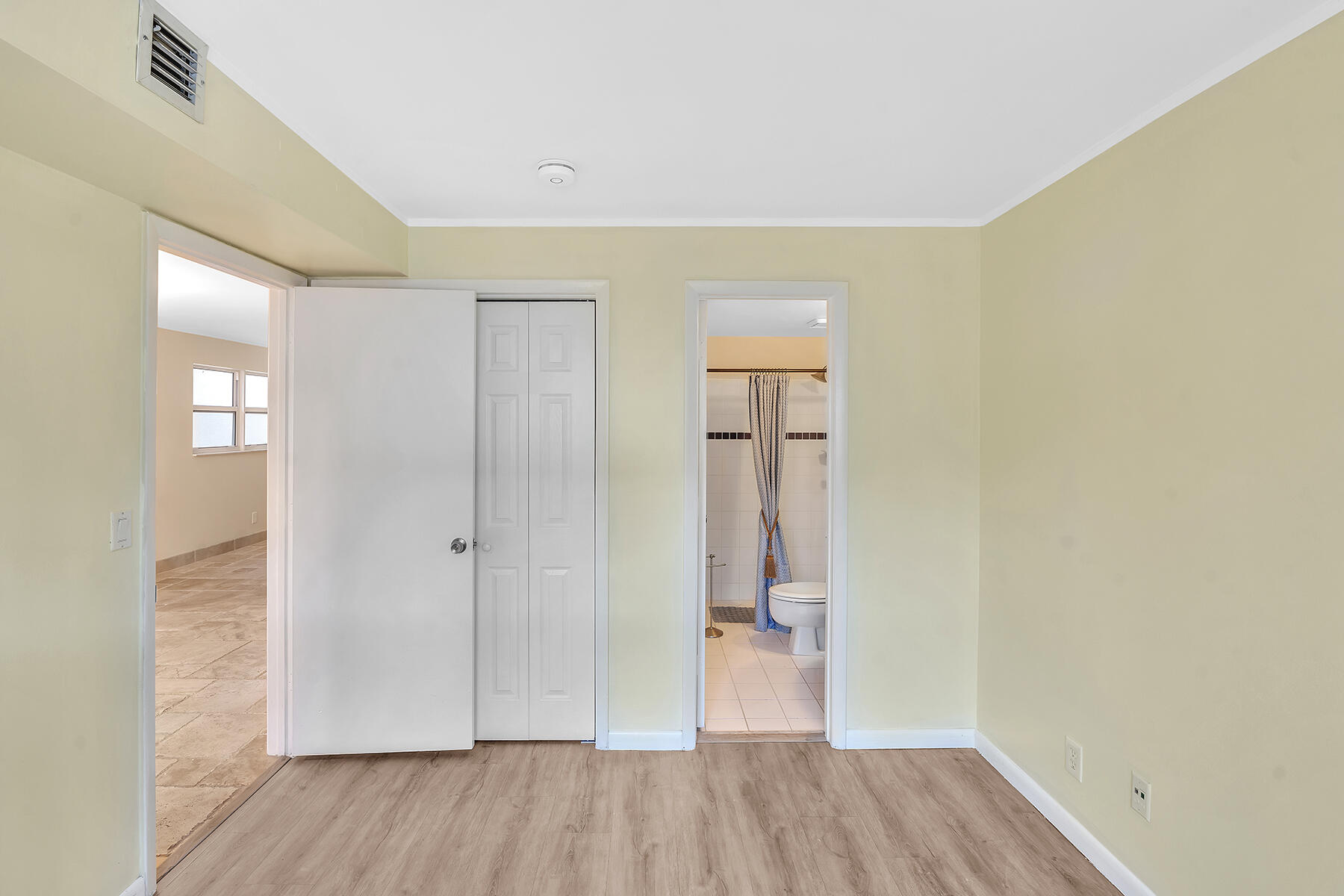 1945 Northwest 4th Avenue, Unit 32C Boca Raton, FL 33432 - Photo 29 of 52 a view of empty room with wooden floor