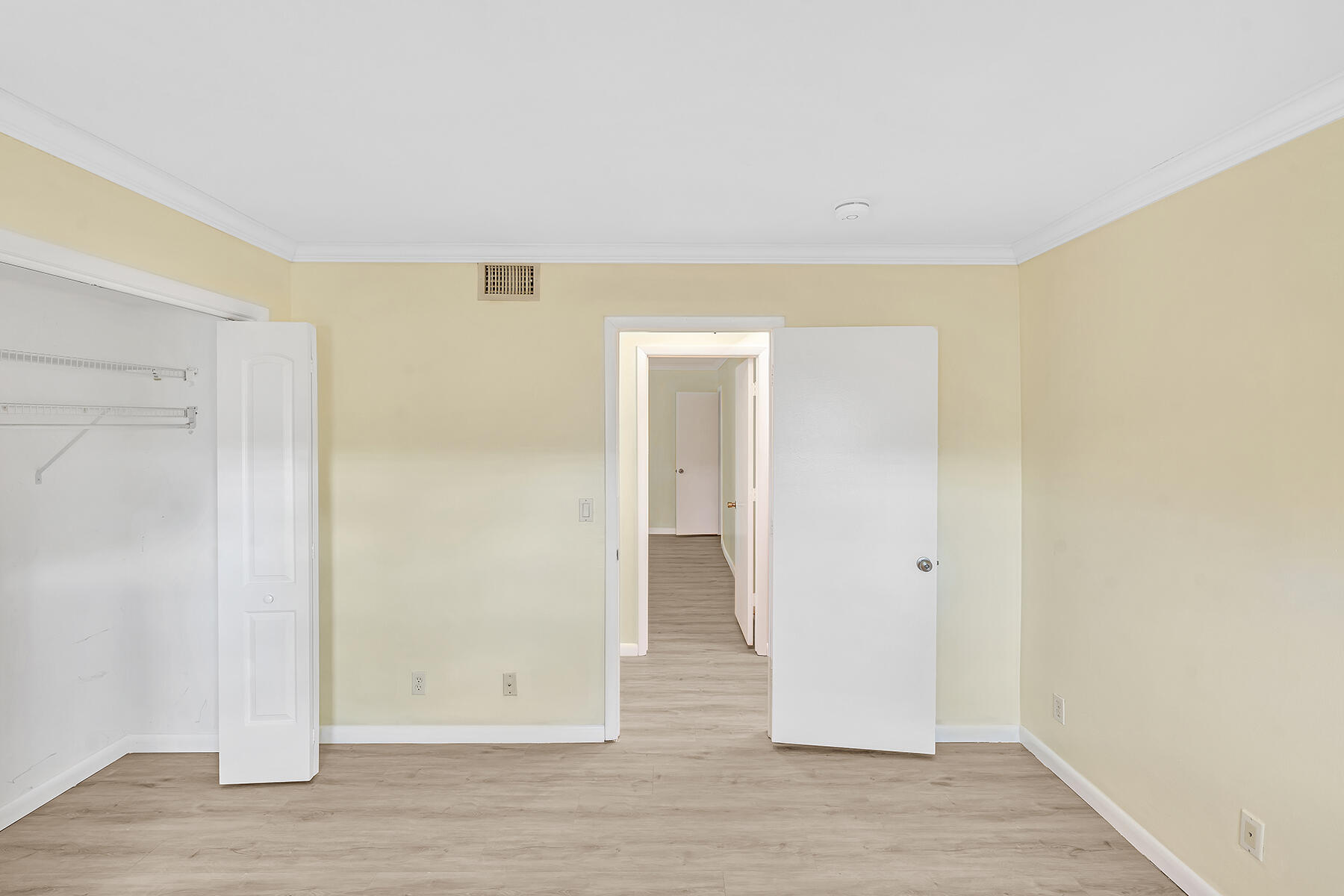 1945 Northwest 4th Avenue, Unit 32C Boca Raton, FL 33432 - Photo 39 of 52 an empty room with wooden floor