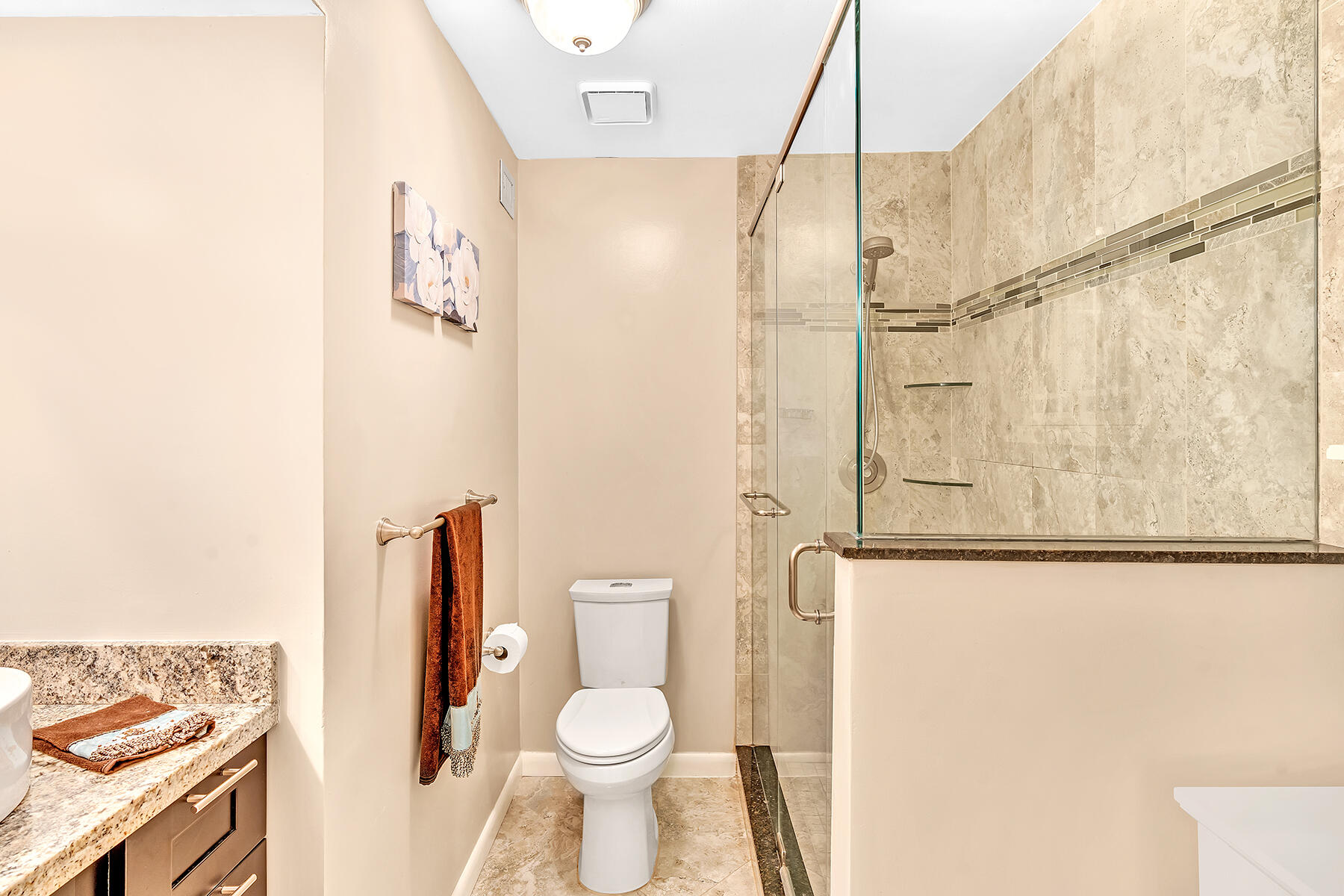 1945 Northwest 4th Avenue, Unit 32C Boca Raton, FL 33432 - Photo 47 of 52 a bathroom with a toilet and a shower