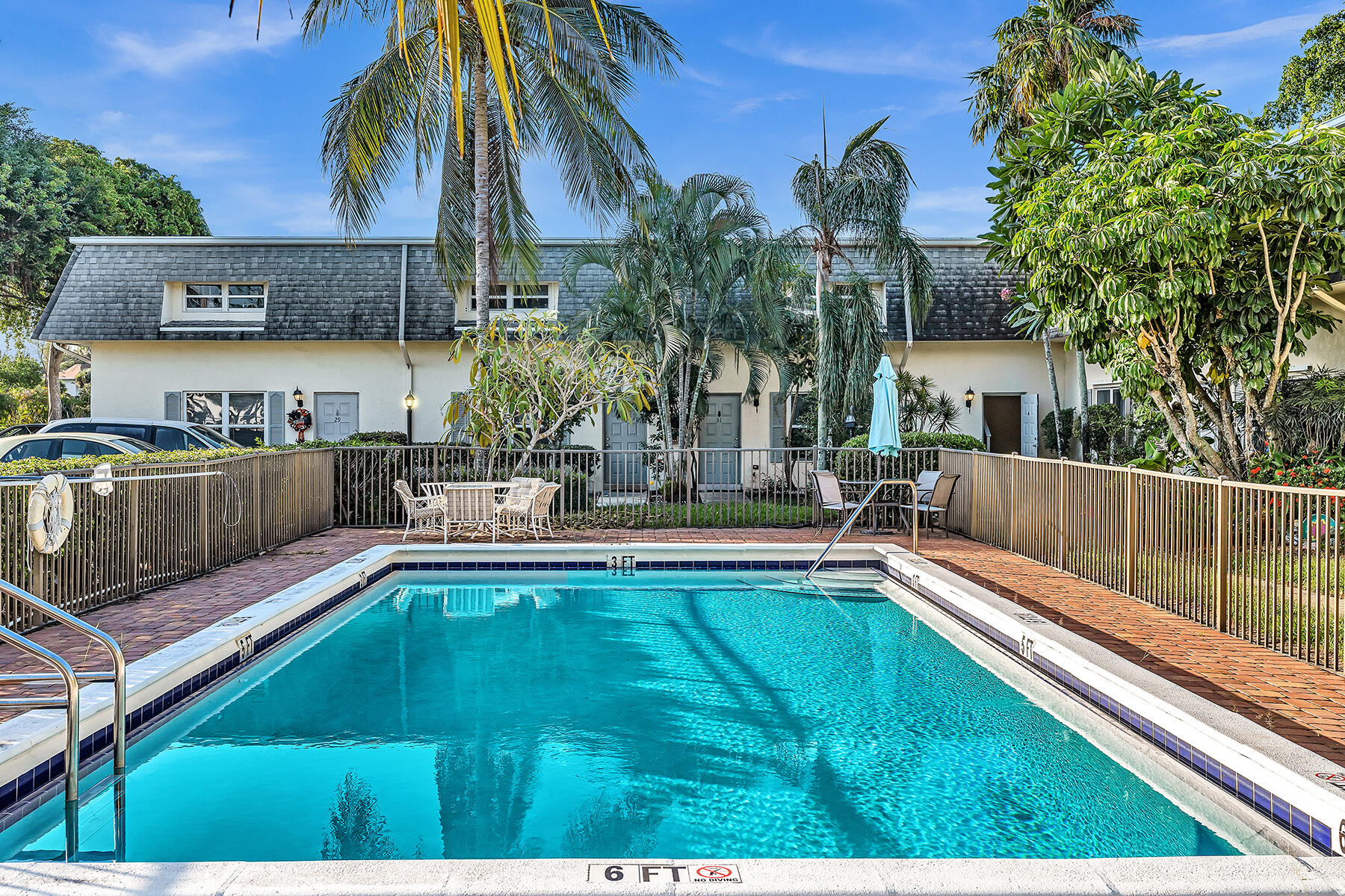 1945 Northwest 4th Avenue, Unit 32C Boca Raton, FL 33432 - Photo 52 of 52 a view of a house and pool