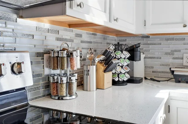 a kitchen with a sink and a stove