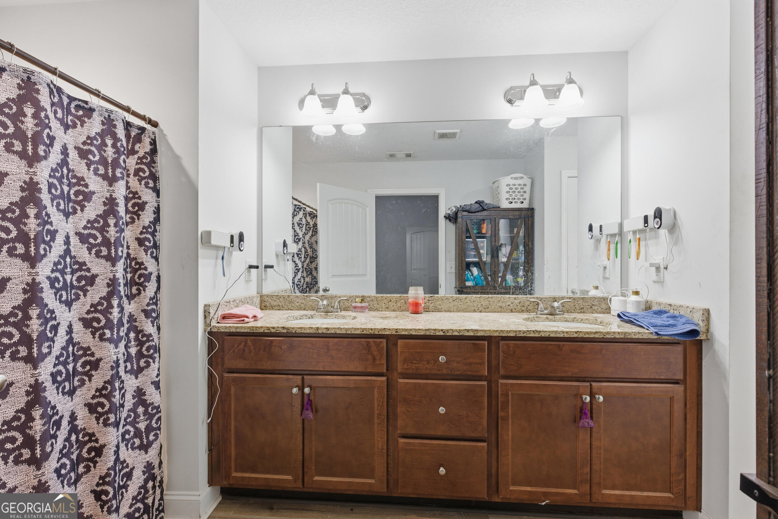 3034 Mt Hebron Road Hartwell, GA 30643 - Photo 19 of 21 a bathroom with a double vanity sink and a mirror