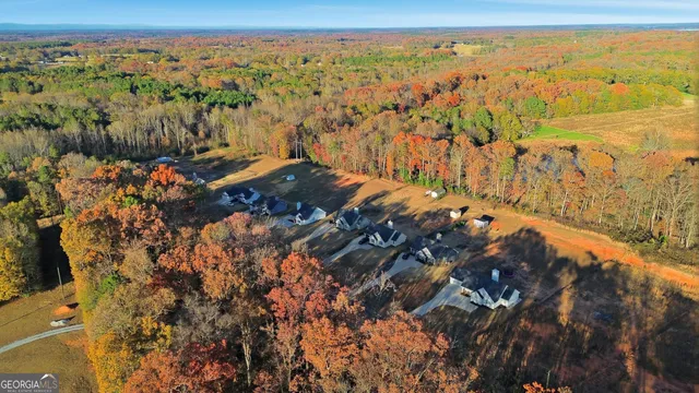 a kitchen with stainless steel appliances kitchen island granite countertop a refrigerator and a stove