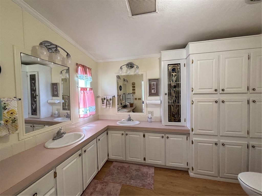 1759 Southwest 35th Circle Okeechobee, FL 34974 - Photo 16 of 29 a bathroom with a sink and a mirror