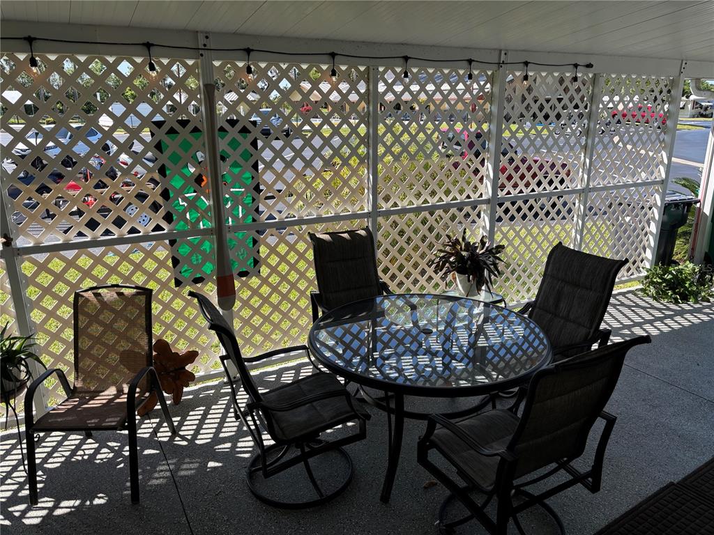 1759 Southwest 35th Circle Okeechobee, FL 34974 - Photo 19 of 29 a view of a chairs and table in a backyard