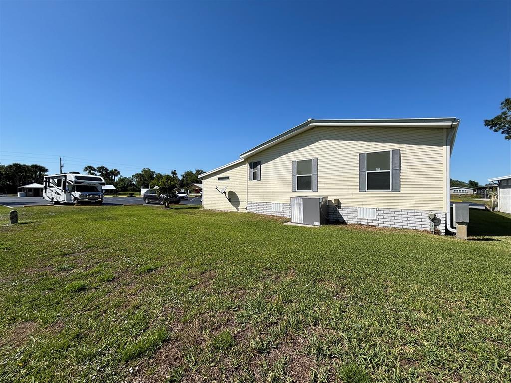1759 Southwest 35th Circle Okeechobee, FL 34974 - Photo 21 of 29 a view of a house with backyard