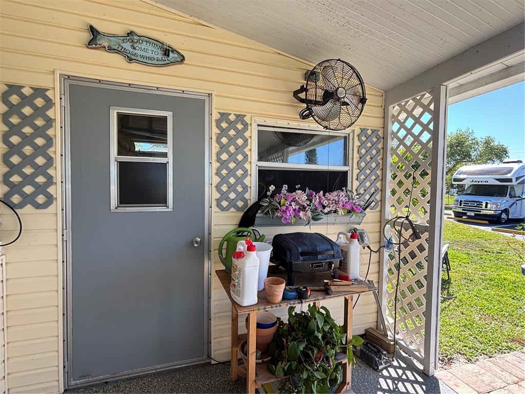 1759 Southwest 35th Circle Okeechobee, FL 34974 - Photo 23 of 29 a table with a vase of flowers on it