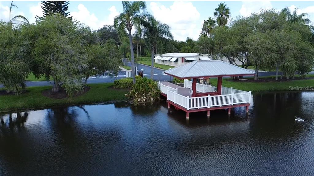 1759 Southwest 35th Circle Okeechobee, FL 34974 - Photo 24 of 29 a backyard of a house with table and chairs