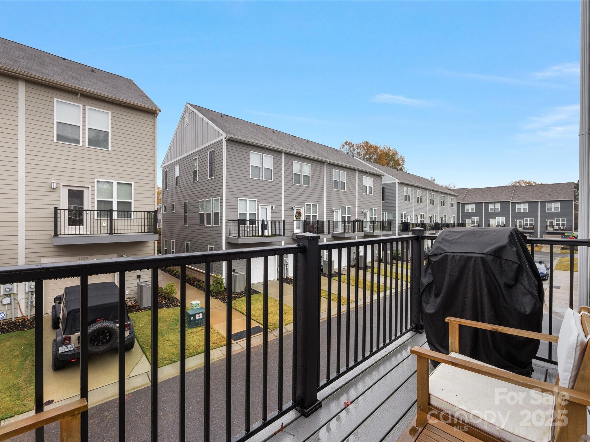 4027 Capital Ridge, Unit 10 Charlotte, NC 28205 - Photo 18 of 34 a view of a balcony with two chairs