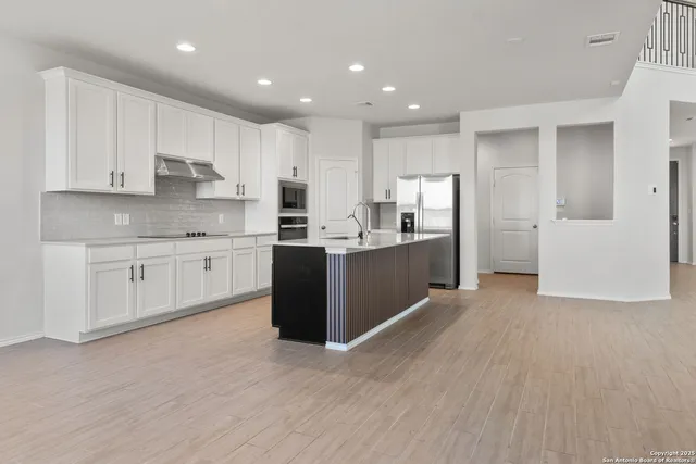 a view of kitchen with wooden floor