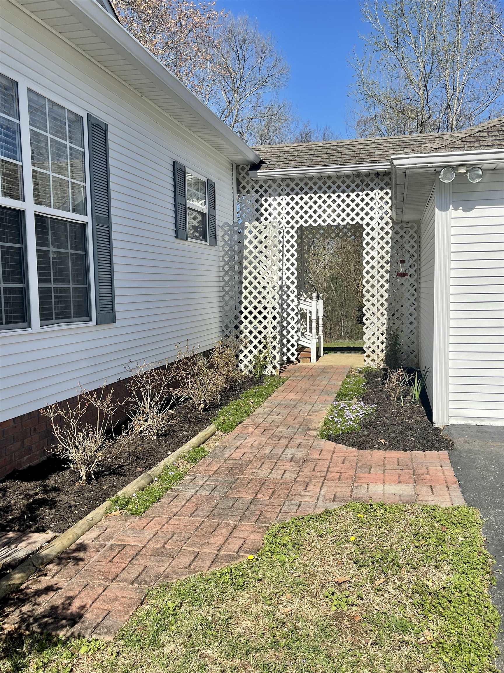 305 New Hope Road Ramer, TN 38367 - Photo 3 of 25 a front view of a house with a yard