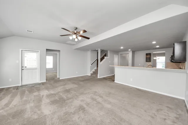 a view of a hallway with stairs