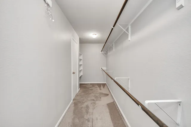 a bathroom with a sink a toilet a mirror and bathtub