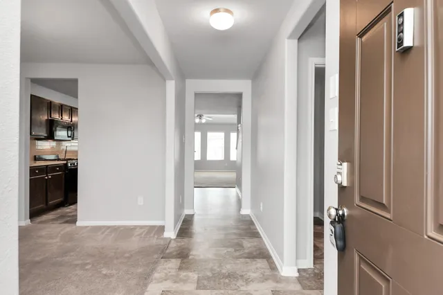 a view of an empty room with a window