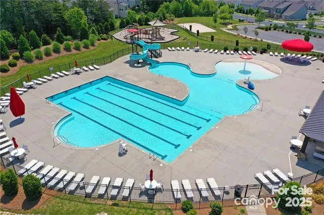 an aerial view of a chairs and table